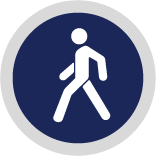 a navy blue icon with a white pedestrian figure walking within it